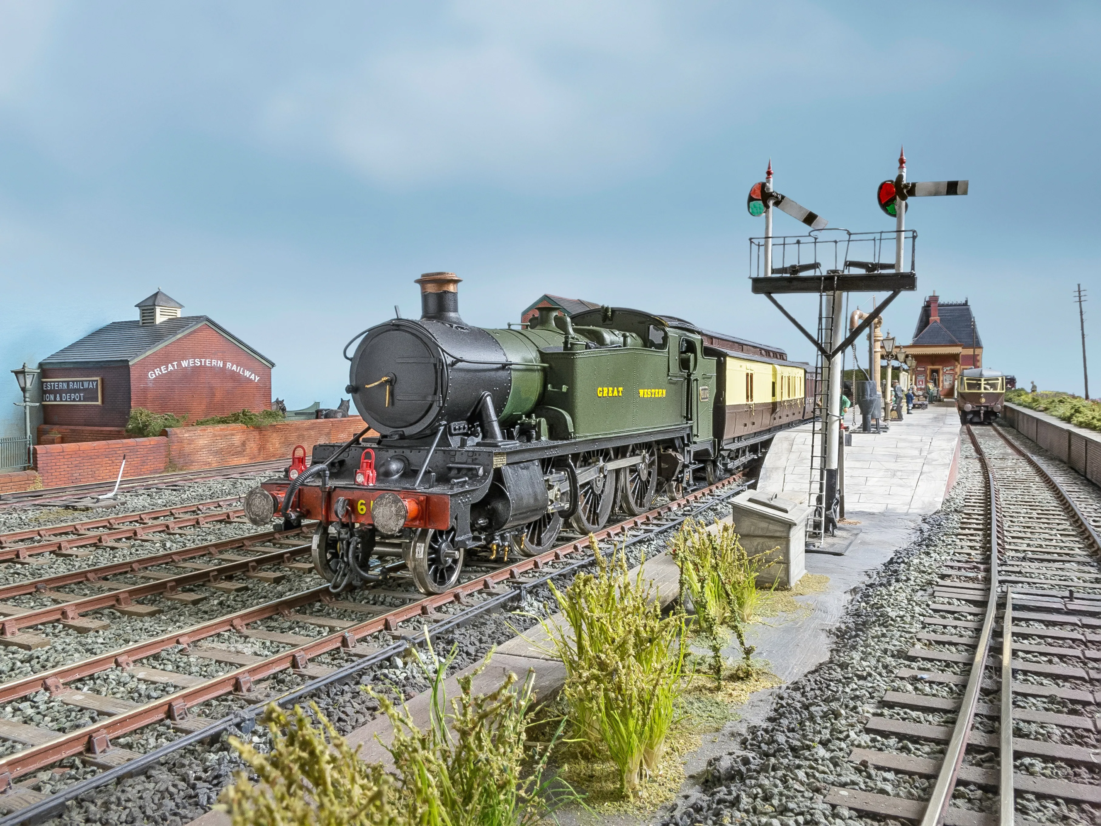 A steam train pulling away from Penfold Priory station